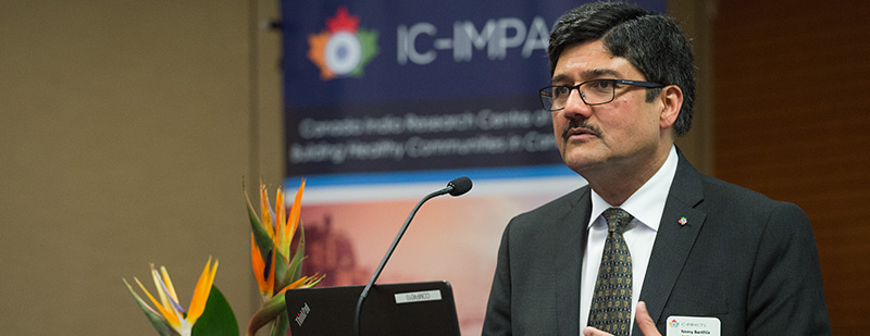 Professor Nemy Banthia pictured at podium during a talk at 2018 IC-IMPACTS Research Conference
